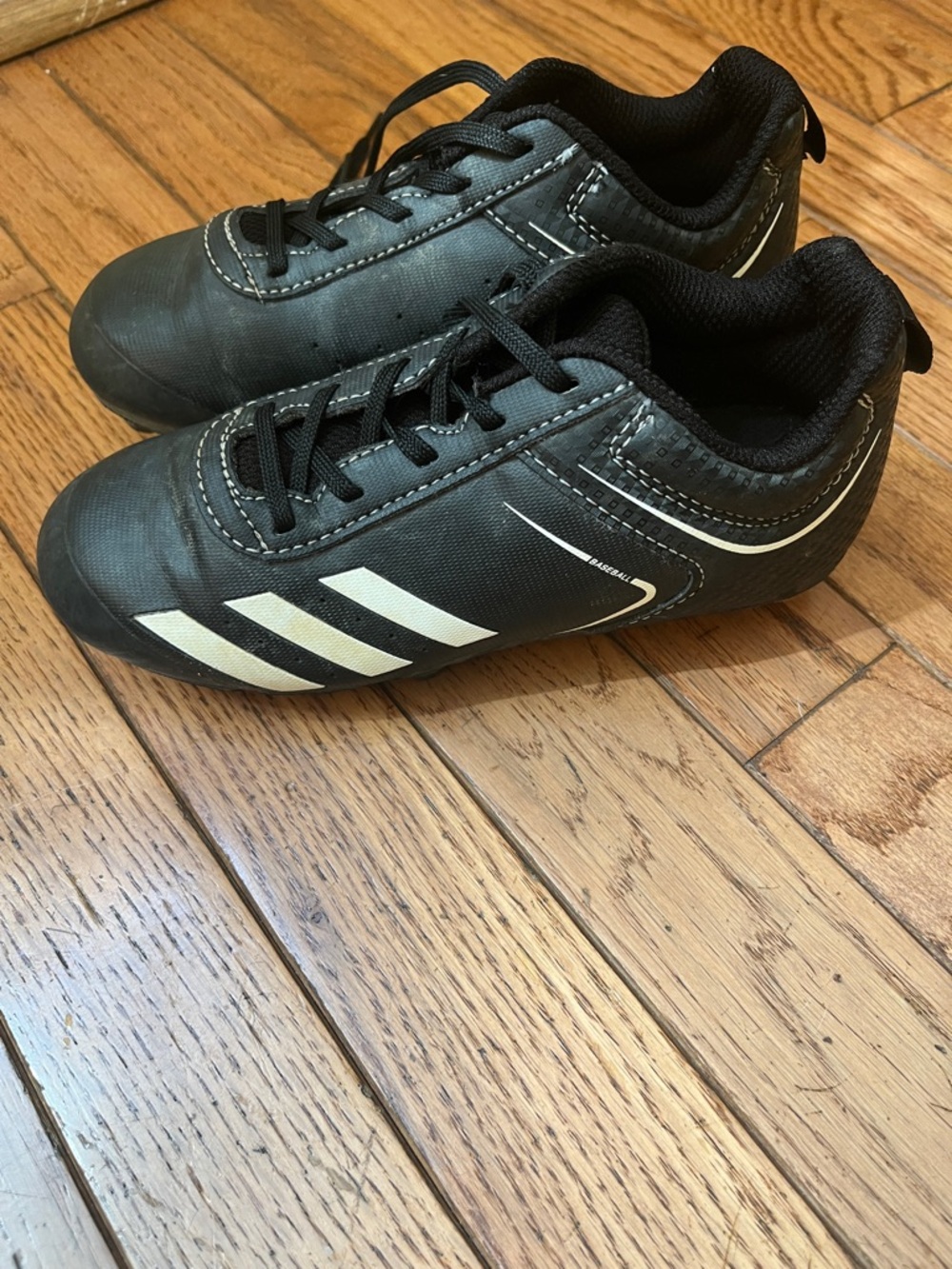 Kids Adidas Black Soccer Cleats with White Stripes